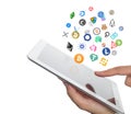 Bitcoin, ethereum and other coin icons flying over the ipad screen in hand of trader on white background