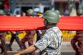 Close-up photo of one of the Turkish soldiers carrying gigantic Turkey flag and marching during August 30, Victory Day parade in