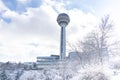 Ankara/Turkey-December 13 2018-Atakule tower and shopping mall in winter time and trees under snow in Botanic Park