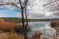 Two young men sitting on a picnic table, feeding the ducks and watching the scenery by the Blue Lake I Mavi Gol in autumn in Ankar