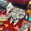 Second hand Lego Star Wars Millennium Falcon, boxed toys, Disney toy vehicles on the showcase in sunday flea market Royalty Free Stock Photo