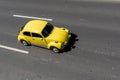 Ankara, Turkey - June 15 2021: Top view of yellow beetle car driving on divided road