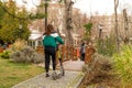 Ankara/Turkey - March 15 2020: Back view of girl rides electric scooter of Marti Tech in kugulu park