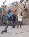 Ankara/Turkey-March 3 2018: Children feeding pigeons and enjoying the day in Kizilay, City center of Ankara