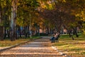 Ankara/Turkey-November 24 2018: Kurtulus Parki in Autumn and a couple sitting on a bench near the path
