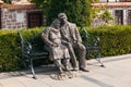 Famous bronze statue of old woman and men sitting on a bench in Hamamonu, Ankara
