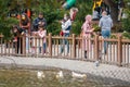 People taking photos of ducks and having good time in open air at Kugulu Park in Ankara