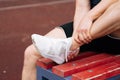 Ankle dislocation by a male athlete.Concept of a sports soccer coach breaking an ankle on a soccer field during training