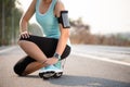 Ankle sprained. Young woman suffering from an ankle injury while exercising and running. Healthcare and sport concept Royalty Free Stock Photo