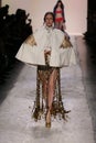 Anna Cleveland walks the runway at the Jeremy Scott show