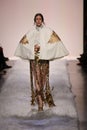 Anna Cleveland walks the runway at the Jeremy Scott show