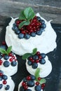 Anna Pavlova dessert with blueberries and red currants Royalty Free Stock Photo