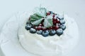Anna Pavlova dessert with blueberries and red currants Royalty Free Stock Photo