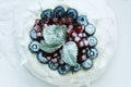 Anna Pavlova dessert with blueberries and red currants Royalty Free Stock Photo