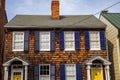 A vintage semidetached house with wooden tile exterior