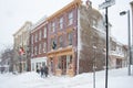 Annapolis street scene of shops during blizzard with snow falling heavily