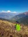 Annapurna Base Camp hiking trek, Himalayas, Nepal. November, 2018. Panoramic view of Dhaulagiri Mountain Range. A hiker resting on