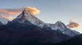 Annapurna South Summit and some clouds during sunrise as seen from Poonhill, Himalayas Royalty Free Stock Photo