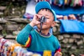 Portrait of smiling Nepalese boy, Annapurna circuit track. Royalty Free Stock Photo