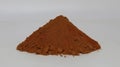 Annatto seed powder put in a small pile.