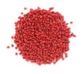 Annatto seeds, isolated on a white background. Achiote seeds, bixa orellana. Natural dye for cooking and food. Close-up