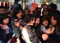 Anne Hathaway poses with fans