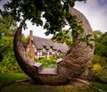 Fairytale thatched roof cottage and gardens in England.