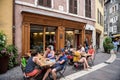 Young customers drinking fresh cold beer outside terrace at Beer o'Clock pub