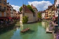 Hotel Le Palais de L'ISle on a canal surrounded by buildings in Annecy, France