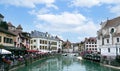 Annecy, France - September 9, 2021: the view of city canal with medieval buildings in Annecy Old Town, Restaurant near the River T Royalty Free Stock Photo