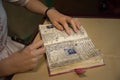 Anne Frank and a close up of her hands in the museum of Madame Tussauds