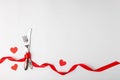 Anniversary, birthsday festive romantic table setting on white background. Silverware, vintage fork, knife with red