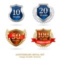 Anniversary golden heraldic labels set Royalty Free Stock Photo