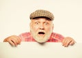 Announcement concept. Event announcement. Senior bearded emotional man peek out of banner place announcement. Pensioner