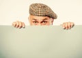 Announcement concept. Senior bearded man peek out of banner place announcement. Advertisement shop. Pensioner Royalty Free Stock Photo