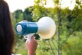 A woman holds a megaphone in her hand Royalty Free Stock Photo