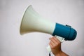 A woman holds a megaphone in her hand Royalty Free Stock Photo