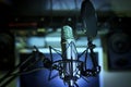 Announcer microphone on recording studio background Royalty Free Stock Photo