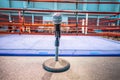 Announcer microphone on table before boxing ring Royalty Free Stock Photo