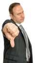 Annoyed, angry business man giving thumbs down Royalty Free Stock Photo