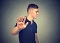 Annoyed angry man with bad attitude giving talk to hand gesture Royalty Free Stock Photo