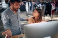 Annoyed and angry man and woman arguing over computer desktop at work about project not going well Royalty Free Stock Photo