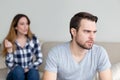 Annoyed husband tired of wife lecturing and arguing