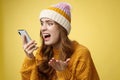 Annoyed pissed freak-out crazy woman shouting smartphone look display near face irritated arguing boyfriend breaking-up Royalty Free Stock Photo