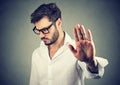 Annoyed angry man with bad attitude giving talk to hand gesture Royalty Free Stock Photo