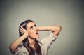 Annoyed stressed woman covering her ears, looking up loud noise upstairs Royalty Free Stock Photo