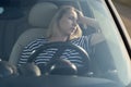 Annoyed tired female on driver seat in car frustrated with heavy traffic jams suffer fatigue stress Royalty Free Stock Photo