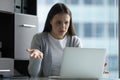 Annoyed woman secretary sitting by computer having problems with connection Royalty Free Stock Photo