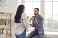 Annoyed young family couple arguing emotionally, blaming each other Royalty Free Stock Photo