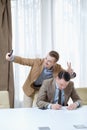 Annoying coworker selfie business work ethics Royalty Free Stock Photo